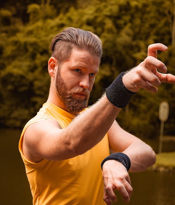 Man performing a controlled strength exercise in a calm, modern environment.